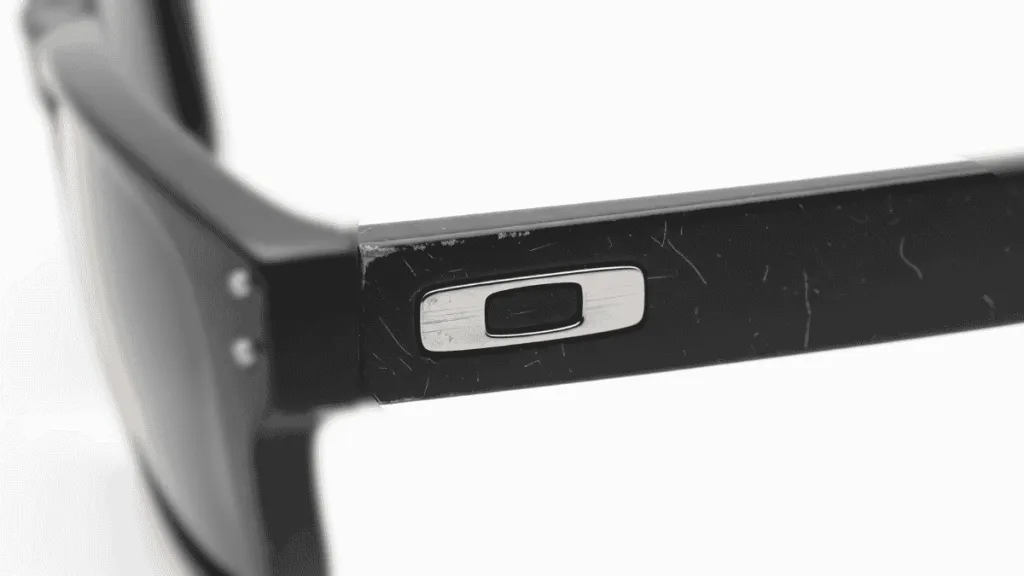 Oakley OO9102 glasses with worn and scratched temple