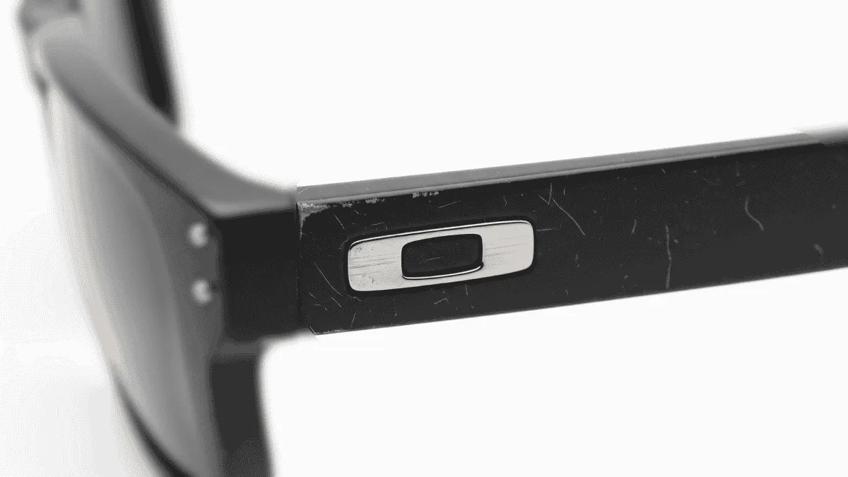 Oakley OO9102 glasses with worn and scratched temple